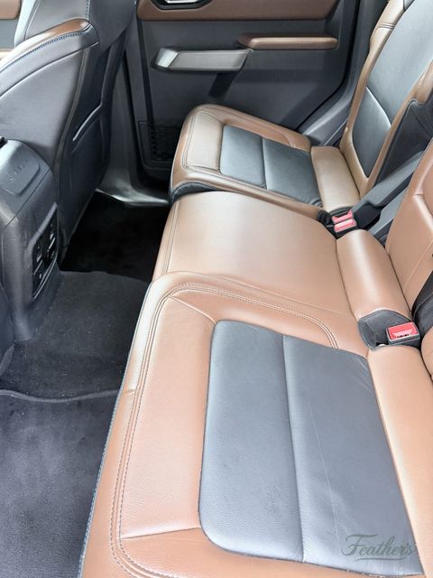 Rear bench of a Ford Bronco after cleaning, tan and grey leather wiped down