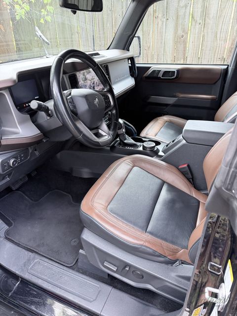 Driver seat, wheel and footwell of a Ford Bronco after cleaning