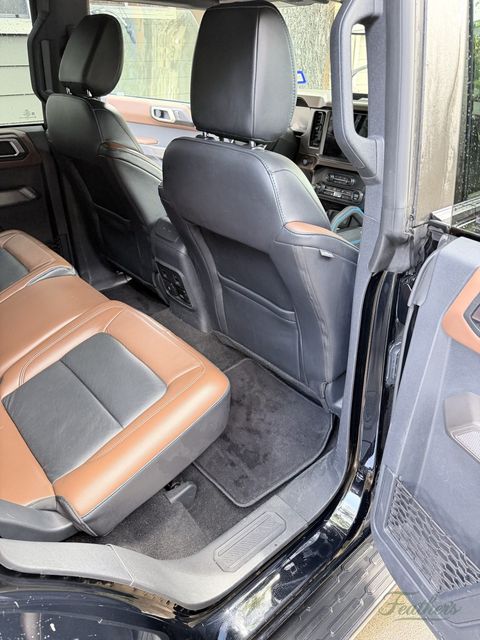Front seats of a Ford Bronco seen from the passenger door after cleaning
